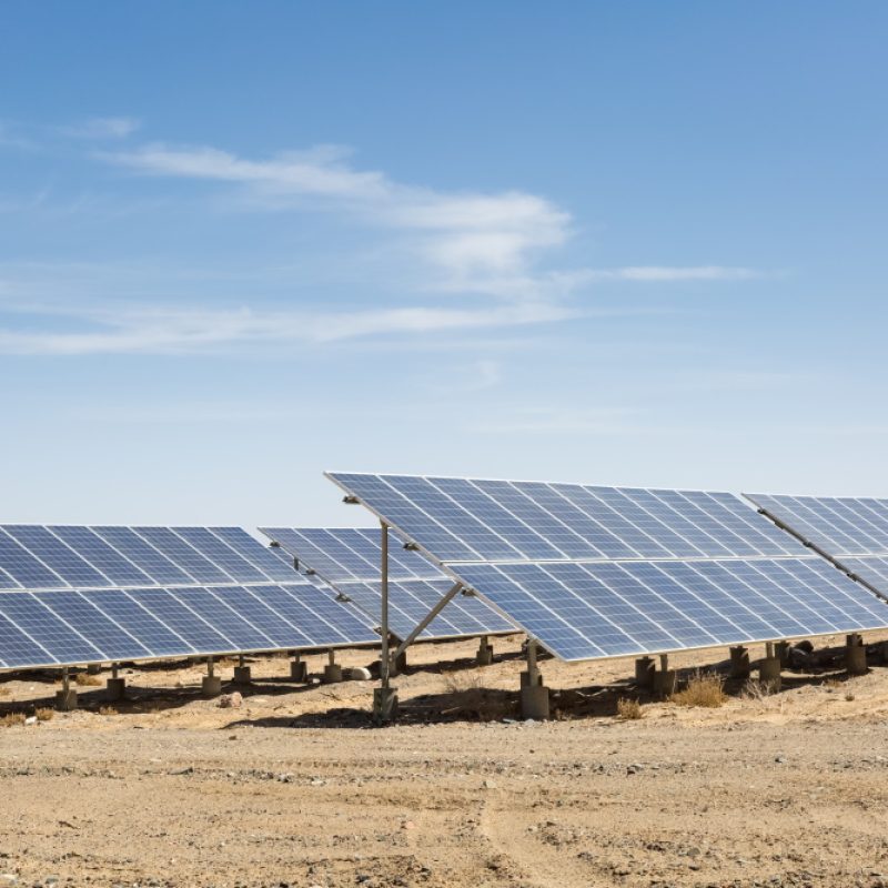 solar panels on the gobi against abundant sunshine sky, clean energy background